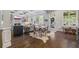 Hardwood floors throughout the living space leading to the kitchen and living room with coffered ceilings at 3111 Old Thompson Mill Rd, Buford, GA 30519