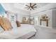 Spacious primary bedroom features luxurious finishes and a custom tray ceiling at 3111 Old Thompson Mill Rd, Buford, GA 30519