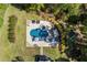 A private backyard oasis features a beautiful in-ground pool, hot tub, and surrounding patio for relaxation and entertainment at 3111 Old Thompson Mill Rd, Buford, GA 30519