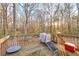 Outdoor view of the wood back deck with patio furniture, a cooler, and natural light at 3434 Saddlebrook Dr, Loganville, GA 30052
