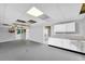 The basement is finished with modern cabinets, lighting, neutral walls and flooring at 3434 Saddlebrook Dr, Loganville, GA 30052