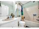 Well-lit bathroom featuring a classic white suite, vanity, and bathtub/shower combo at 3434 Saddlebrook Dr, Loganville, GA 30052