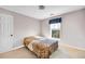 Cozy bedroom featuring a window and a comfortable-looking bedspread at 3434 Saddlebrook Dr, Loganville, GA 30052