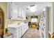 Kitchen featuring white cabinets, appliances, and a functional layout with lots of potential at 3434 Saddlebrook Dr, Loganville, GA 30052