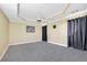The main bedroom has neutral walls and flooring with a tray ceiling and ceiling fan at 3434 Saddlebrook Dr, Loganville, GA 30052