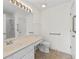 Spacious bathroom featuring vanity, toilet, and accessible shower at 3716 Vineyards Lake Nw Cir # U-2, Kennesaw, GA 30144