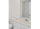 Clean bathroom featuring white cabinets, sink, and a toilet at 3716 Vineyards Lake Nw Cir # U-2, Kennesaw, GA 30144