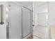 Bright bathroom featuring a spacious shower with frosted sliding doors and a convenient grab bar at 3716 Vineyards Lake Nw Cir # U-2, Kennesaw, GA 30144