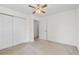 Neutral bedroom boasts closet space and a ceiling fan at 3716 Vineyards Lake Nw Cir # U-2, Kennesaw, GA 30144
