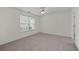 Spacious bedroom featuring neutral walls, plush carpeting, and a bright window with blinds at 3716 Vineyards Lake Nw Cir # U-2, Kennesaw, GA 30144