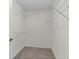 Walk-in closet with shelving and carpeted flooring at 3716 Vineyards Lake Nw Cir # U-2, Kennesaw, GA 30144