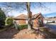 Brick exterior home with mature trees and landscaping, offering a serene living environment at 3716 Vineyards Lake Nw Cir # U-2, Kennesaw, GA 30144