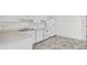 Well-lit kitchen features white cabinetry and modern appliances at 3716 Vineyards Lake Nw Cir # U-2, Kennesaw, GA 30144