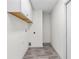 A clean laundry room featuring shelving and plank flooring at 3716 Vineyards Lake Nw Cir # U-2, Kennesaw, GA 30144
