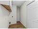 Clean laundry room featuring wood-look flooring, cabinets, and washer-dryer hookups at 3716 Vineyards Lake Nw Cir # U-2, Kennesaw, GA 30144