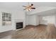 Open-concept living room and kitchen featuring vaulted ceilings and wood-look flooring at 3716 Vineyards Lake Nw Cir # U-2, Kennesaw, GA 30144
