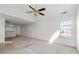 Spacious living room with vaulted ceiling, ceiling fan, and natural light, awaiting your personal touch at 3716 Vineyards Lake Nw Cir # U-2, Kennesaw, GA 30144