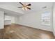 Large and bright living room featuring a ceiling fan and wood-look flooring at 3716 Vineyards Lake Nw Cir # U-2, Kennesaw, GA 30144