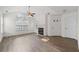 Inviting living room boasts vaulted ceilings, a cozy fireplace, and modern wood-look floors at 3716 Vineyards Lake Nw Cir # U-2, Kennesaw, GA 30144