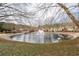 Picturesque pond with a fountain, surrounded by lush greenery and well-kept grounds at 3716 Vineyards Lake Nw Cir # U-2, Kennesaw, GA 30144