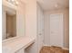 Neutral bathroom with a large mirror and a toilet at 6595 Browns Mill Ferry Dr, Lithonia, GA 30038