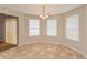 This bright dining room features tile floors and natural light from two windows at 6595 Browns Mill Ferry Dr, Lithonia, GA 30038