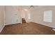 Spacious living room featuring vaulted ceilings, carpeted floors and a staircase to the upper level at 6595 Browns Mill Ferry Dr, Lithonia, GA 30038