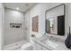 Modern bathroom featuring a tiled walk-in shower and a sleek vanity with a stylish mirror at 1273 Danner Se St, Atlanta, GA 30316