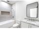 Modern bathroom featuring a shower and tub combination, sleek fixtures, and a stylish vanity at 1273 Danner Se St, Atlanta, GA 30316