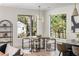 Bright dining area with modern table set and ample natural light from large windows at 1273 Danner Se St, Atlanta, GA 30316