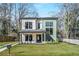 New construction home featuring modern architectural design, a well-manicured lawn, and professional landscaping at 1273 Danner Se St, Atlanta, GA 30316