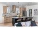 Stylish kitchen featuring an island, stainless steel appliances, designer lighting, and sleek countertops at 1273 Danner Se St, Atlanta, GA 30316