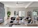 Spacious living room with sliding glass doors, modern decor, and a glimpse of the outdoor space at 1273 Danner Se St, Atlanta, GA 30316