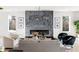 Elegant living room with a modern fireplace, neutral furniture, and bright natural light at 1273 Danner Se St, Atlanta, GA 30316