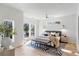Spacious main bedroom featuring hardwood floors, a ceiling fan, and multiple windows for ample natural light at 1273 Danner Se St, Atlanta, GA 30316