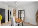 Bright home office featuring a wooden desk, built-in shelving, and access to bathroom at 1273 Danner Se St, Atlanta, GA 30316
