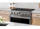 Close-up of a modern, stainless steel oven in a kitchen with light-colored cabinets and sleek countertops at 1273 Danner Se St, Atlanta, GA 30316