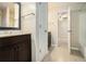 En-suite bathroom with a dark wood vanity and a tiled floor at 1474 Benjamin Sw Ct, Marietta, GA 30064