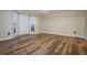 Bright bedroom features attractive plank floors, large windows with shades, and neutral wall colors at 1474 Benjamin Sw Ct, Marietta, GA 30064