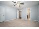 Large bedroom with neutral walls, carpet, and access to an en-suite bath at 1474 Benjamin Sw Ct, Marietta, GA 30064