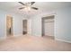 Bedroom featuring plush carpeting and a walk-in closet with custom shelving at 1474 Benjamin Sw Ct, Marietta, GA 30064