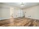 Spacious main bedroom boasting plank flooring, dual closets, and an attached bathroom at 1474 Benjamin Sw Ct, Marietta, GA 30064
