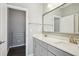 Well-lit bathroom featuring a double vanity, white marble countertops and modern fixtures at 2029 Havenhurst Way, Auburn, GA 30011