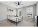 Cozy bedroom with neutral walls, plush carpet, and bright, airy windows at 2029 Havenhurst Way, Auburn, GA 30011