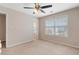 Bedroom with a ceiling fan and window at 923 Port West Dr, Auburn, GA 30011