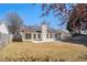 A spacious backyard with a patio, lawn, and privacy fence, offering an ideal outdoor space at 2794 Hillvale Cove Way, Lithonia, GA 30058