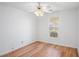 Bedroom featuring a ceiling fan, a window and hardwood floors at 2794 Hillvale Cove Way, Lithonia, GA 30058
