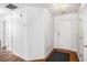 Bright entryway with neutral walls, wood-look flooring, and white doors at 2794 Hillvale Cove Way, Lithonia, GA 30058
