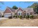 Inviting brick home with a bay window, complemented by lush landscaping and a neatly kept lawn at 2794 Hillvale Cove Way, Lithonia, GA 30058