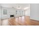 Spacious living room featuring a fireplace, wood-look floors, and lots of natural light at 2794 Hillvale Cove Way, Lithonia, GA 30058